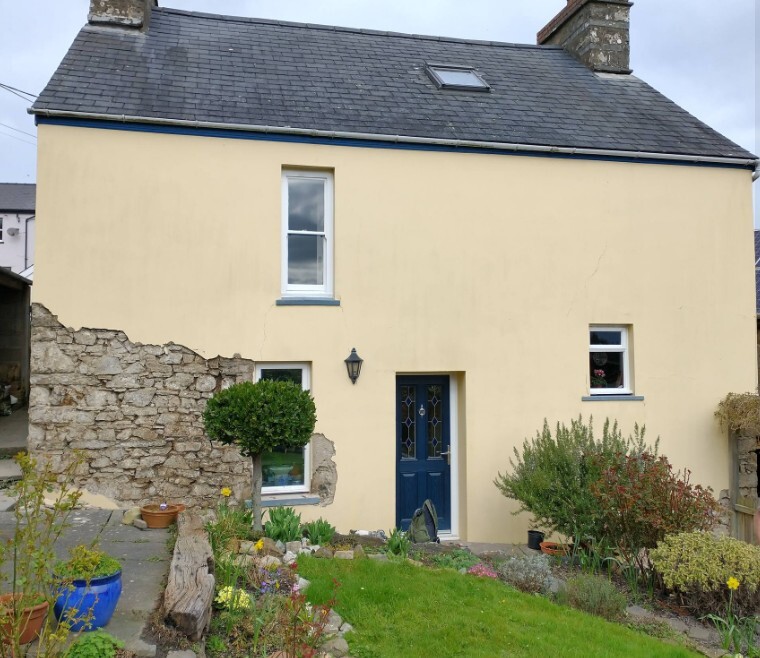Stone Cottage with cement render