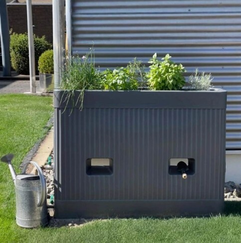 Rainwater harvesting with herb garden planter 
